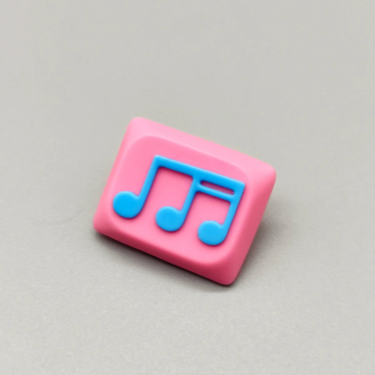 Vibrant pink and blue Musical Note Low Shaft Keycaps showcasing a fluid music note design, perfect for artistic keyboard setups.