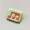 Vibrant green-pink Musical Note Low Shaft Keycaps showcasing a handcrafted, fluid music note design, embodying artistic and playful aesthetics.