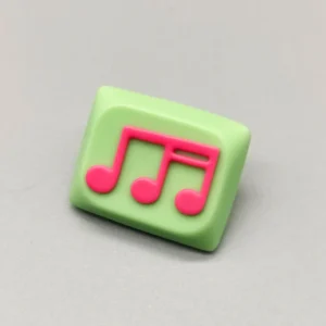 Vibrant green-pink Musical Note Low Shaft Keycaps showcasing a handcrafted, fluid music note design, embodying artistic and playful aesthetics.