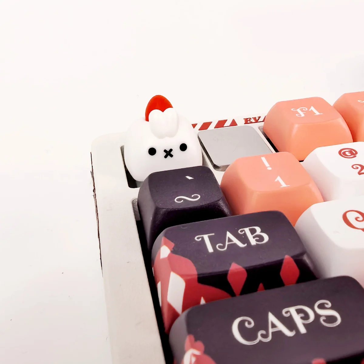 Whimsical artisan rabbit ESC keycap with a strawberry design. Handcrafted, showcasing tactile embossed texture and artistic details for a delightful design.