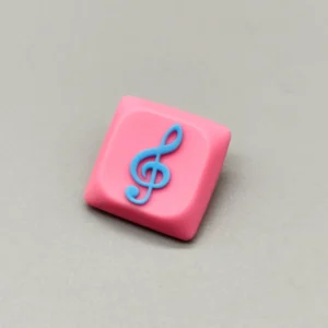 Vibrant pink base Treble Clef Low Shaft Keycaps, handcrafted from resin, showcasing a glossy treble clef symbol.