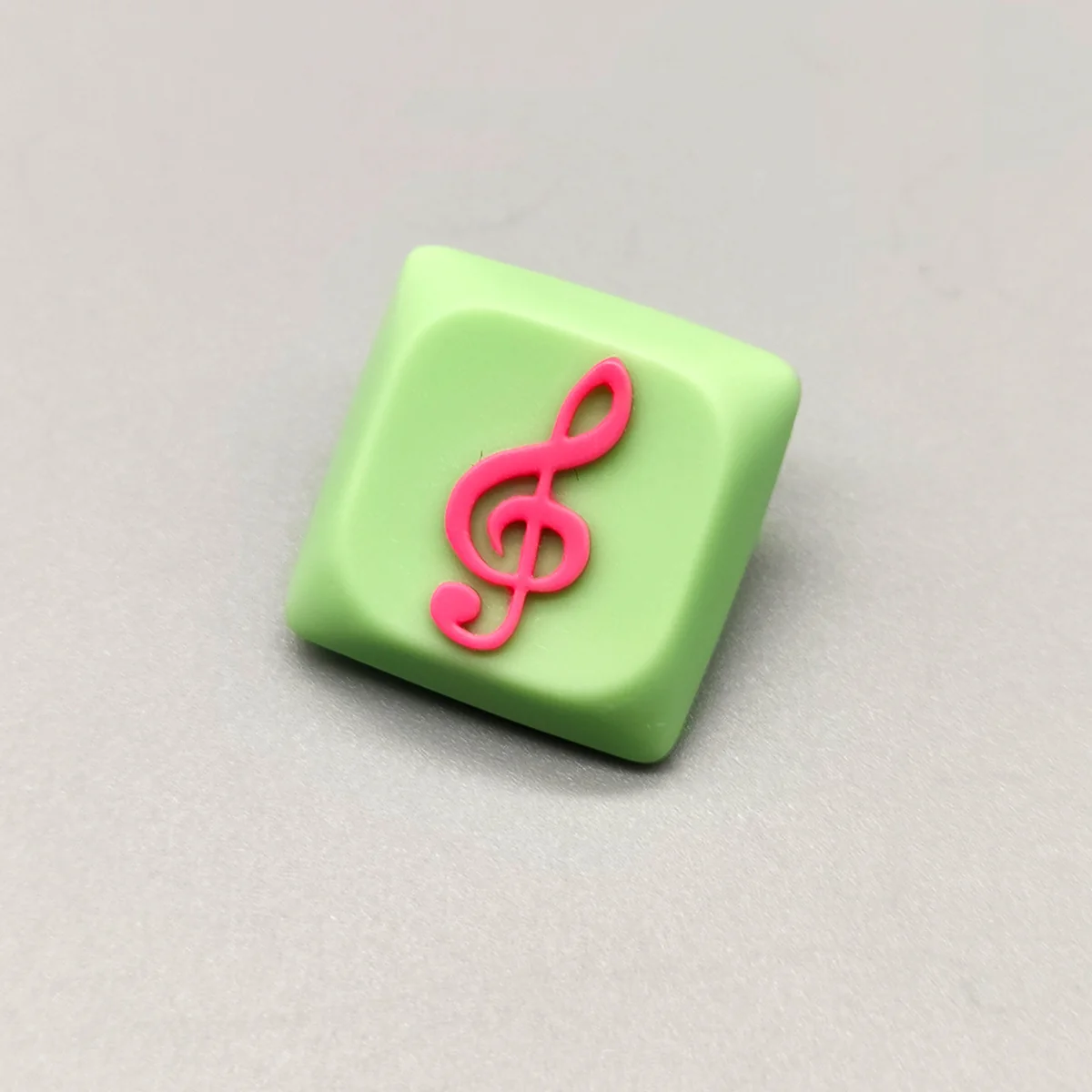 Treble Clef Low Shaft Keycaps featuring a vibrant treble clef on a playful green base, a unique musical note accessory.
