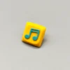 Vibrant Two Beam Eighth Note Symbol Keycaps featuring a yellow base and an intricately embedded rhythm symbol.