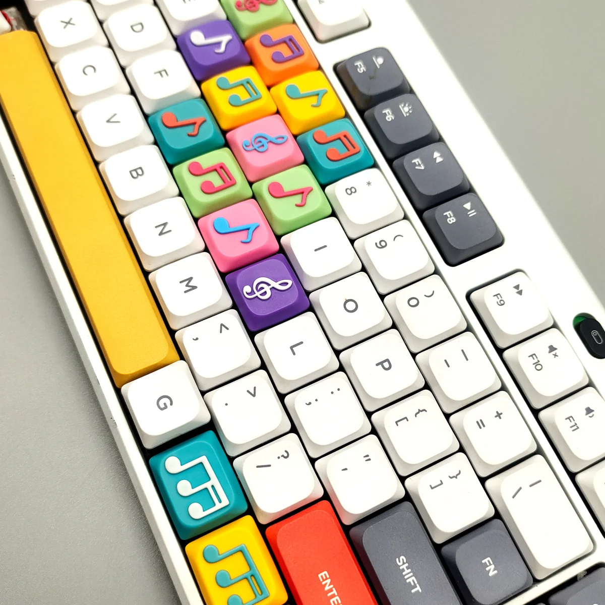 Vibrant handcrafted Two Beam Eighth Note Symbol Keycaps from multiple artistic angles, revealing translucent musical notes and colorful bases.