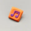 Handcrafted Two Beam Eighth Note Symbol Keycaps featuring a vibrant orange translucent resin base and an embedded rhythm symbol, showcasing artistic flair.