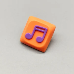 Handcrafted Two Beam Eighth Note Symbol Keycaps featuring a vibrant orange translucent resin base and an embedded rhythm symbol, showcasing artistic flair.