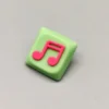 Handcrafted Two Beam Eighth Note Symbol Keycaps with a vibrant translucent resin rhythm symbol set on a striking green base, showcasing unique artistic flair.