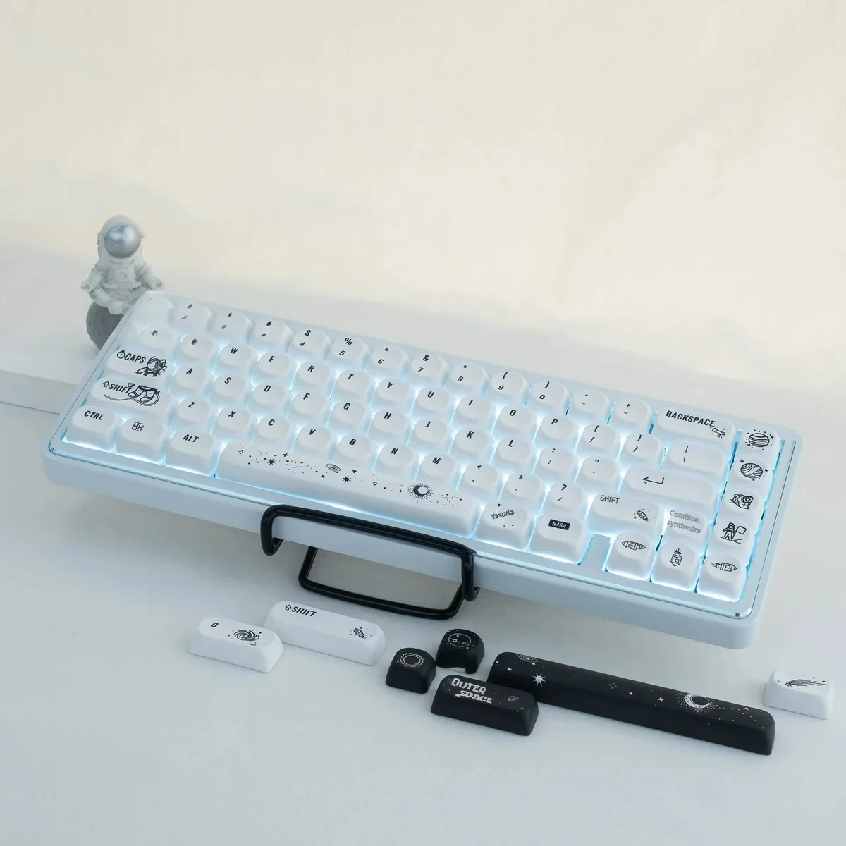 Astronaut PBT MOA keycap set: detailed views of cosmic artistry. Stylized astronaut and celestial designs, durable PBT, ergonomic MOA.