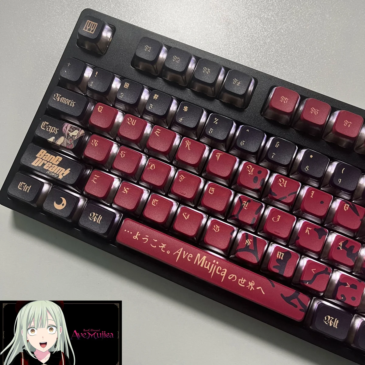 A gallery of Luminous BanG Dream Ave Mujica PBT keycaps set, displaying their vibrant, all-around backlit legends and dark, stylized artistic design.