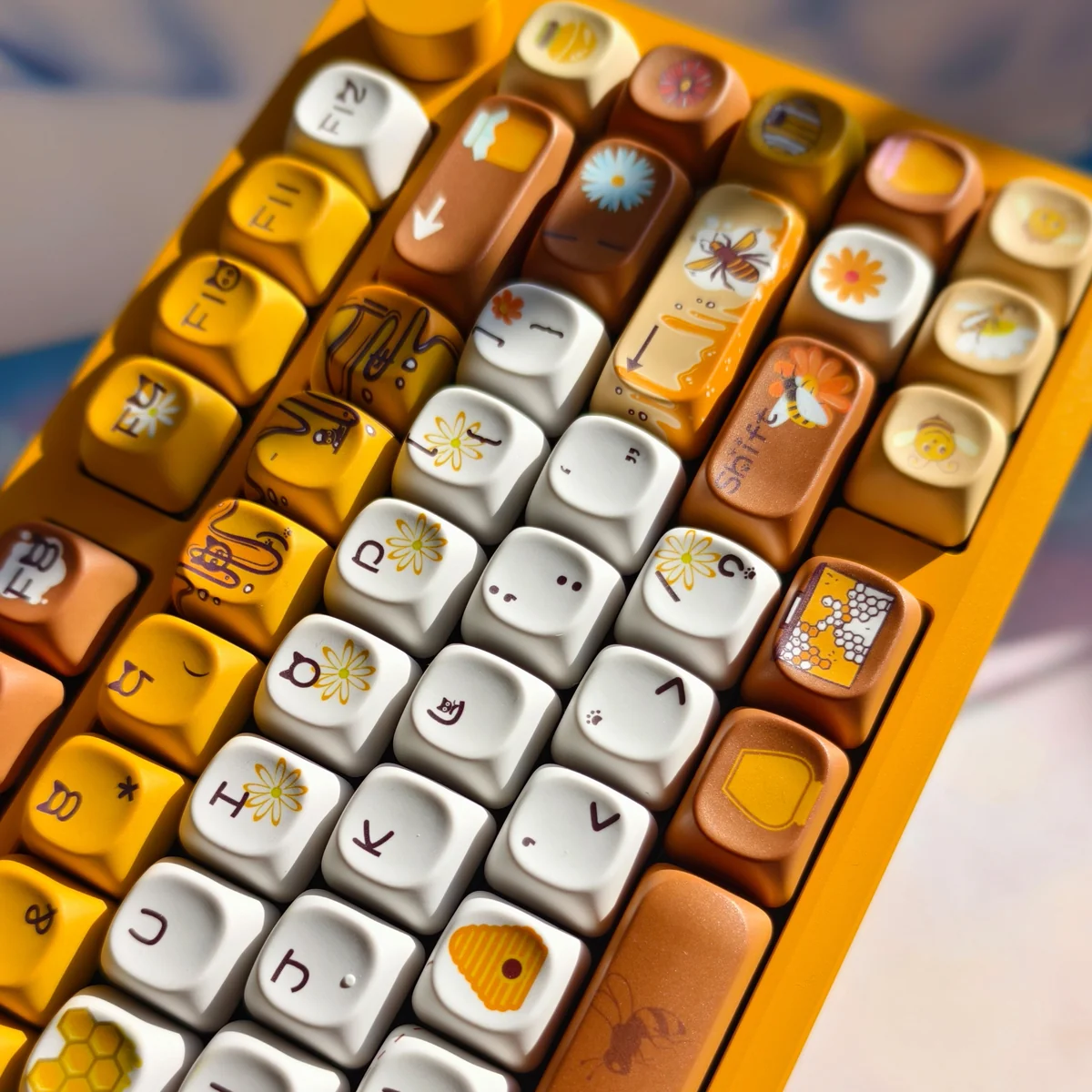 A delightful gallery of Honey Buzz Bee PBT keycaps set, featuring vibrant dye-sub bees, honeycombs, and flowers from different playful angles.