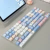 Playful White Rabbit MOA PBT keycaps set showcasing the iconic milky white and red theme from multiple angles, highlighting the comfy spherical profile.