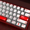 A collection of Blood Rose Keycaps Set, showcasing their unique pearlescent metallic finish and dark gothic elegance from various angles.