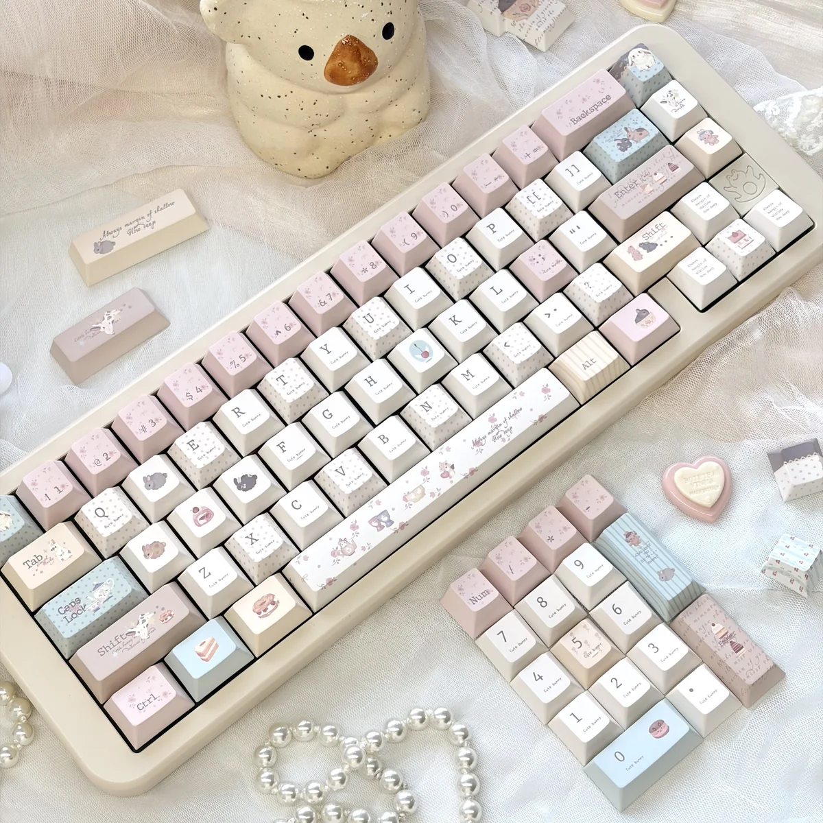 Whimsical pastel bunny keycaps set from the Dessert Party Set, showcasing adorable bunnies enjoying sweets across various angles of the mechanical keyboard.