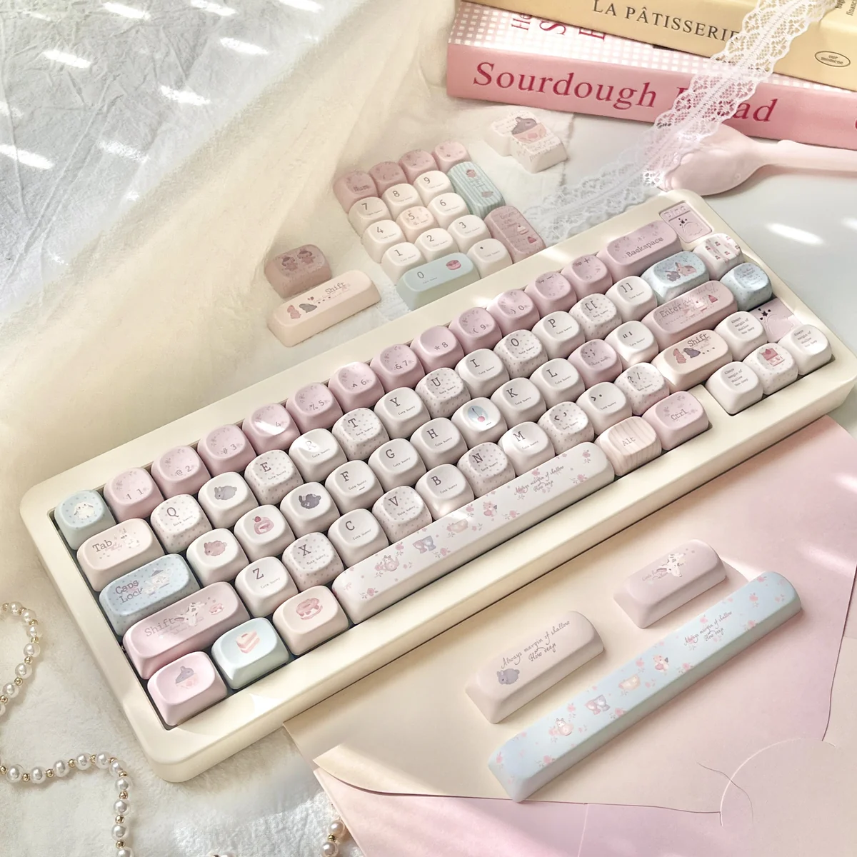 A delightful collection of whimsical pastel bunny keycaps set from the Dessert Party Set, shown from various angles, highlighting their charming mechanical keyboard.