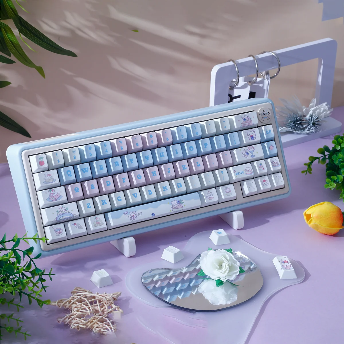 Adorable Cat Cake PBT dye-sub keycap set shown from various angles. Features whimsical pastel cat and cake motifs for a delightful keyboard.