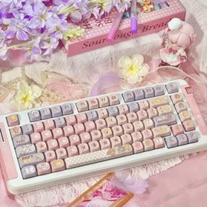 Iconic Cardcaptor Sakura PBT dye-sub keycaps set showcasing whimsical pastel pink and purple magical anime motifs.
