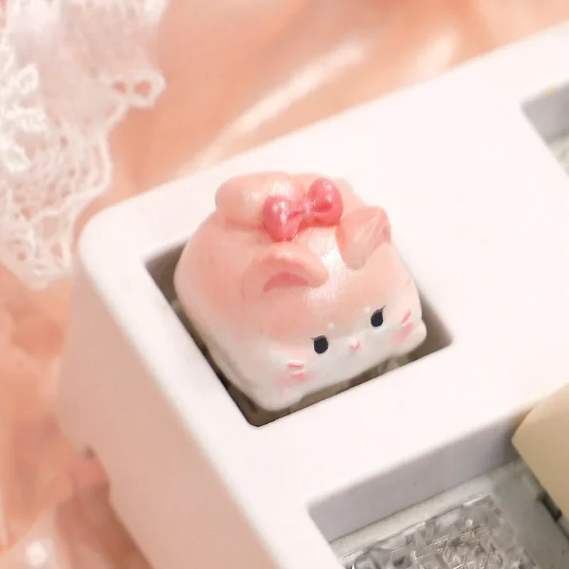 Playful handcrafted adorable sweet cat artisan keycap in pastel tones, showcasing intricate details from multiple charming angles.