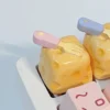 Handcrafted whimsical cheesecake artisan keycap. Adorable miniature, realistic dessert with playful fork detail. Vibrant, premium keyboard accessory,