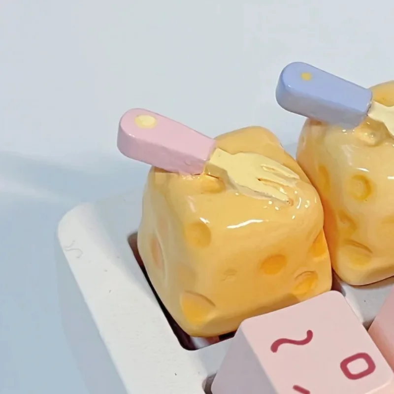 Handcrafted whimsical cheesecake artisan keycap. Adorable miniature, realistic dessert with playful fork detail. Vibrant, premium keyboard accessory,