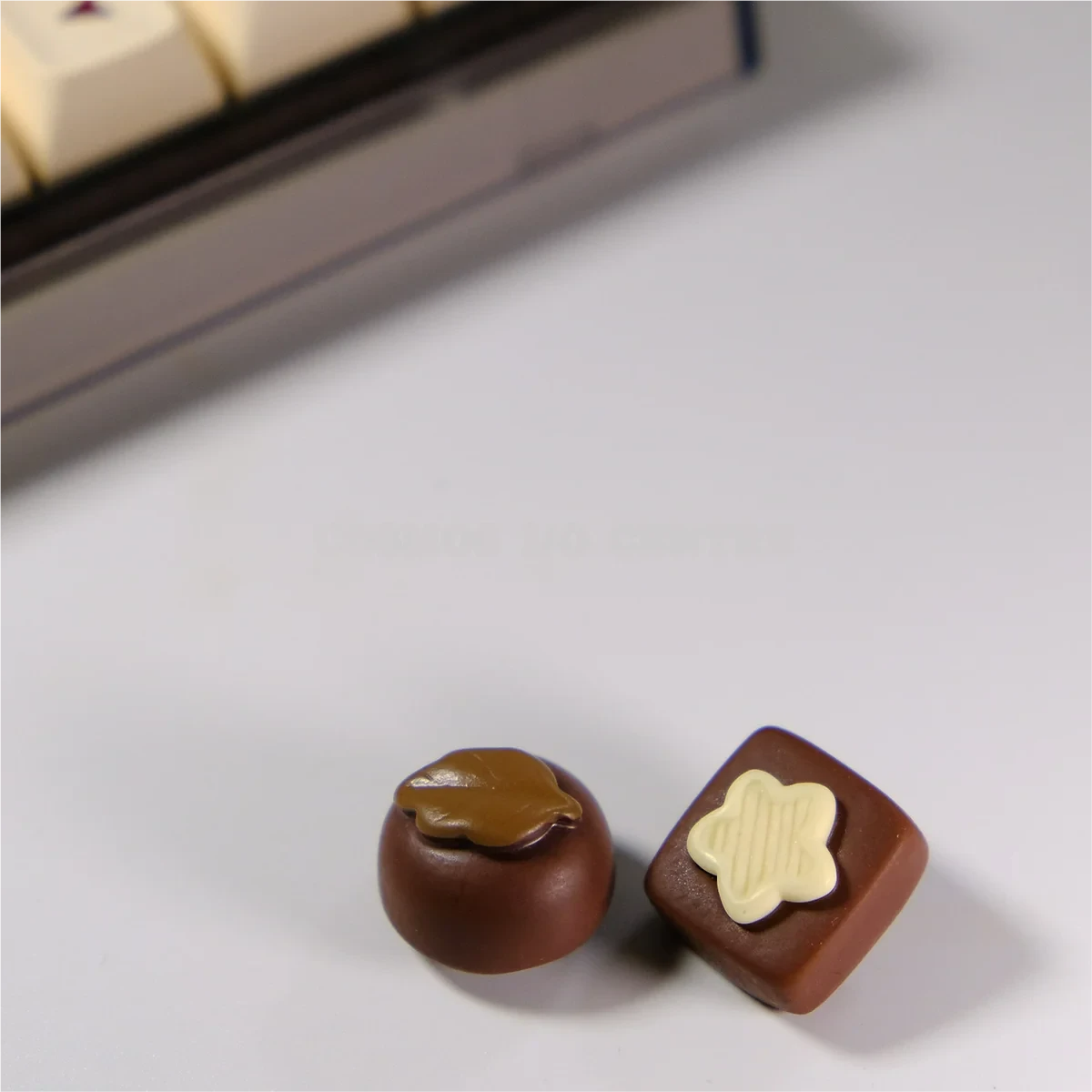 Handcrafted artisan chocolate biscuit keycap, showcasing realistic 3D design and rich brown hues from multiple delightful angles for custom keyboards.