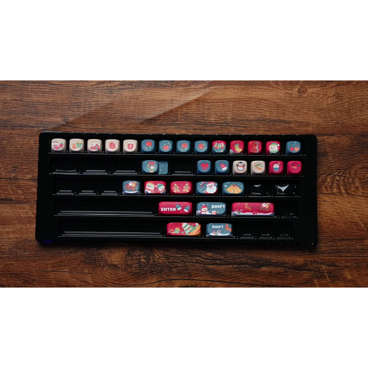 Gallery of whimsical Christmas PBT keycaps set, SO profile, displaying durable dye-sublimated designs of festive characters, snowy landscapes, and vibrant design.