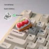Handcrafted Cream Raspberry Layer TAB Keycap. This artisan keycap reveals intricate layered cream and raspberry details from a unique angle.