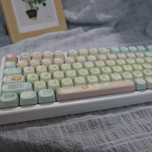 Adorable pink and white PBT cute cat keycaps set for a playful keyboard. Durable PBT material with charming cartoon cat designs.