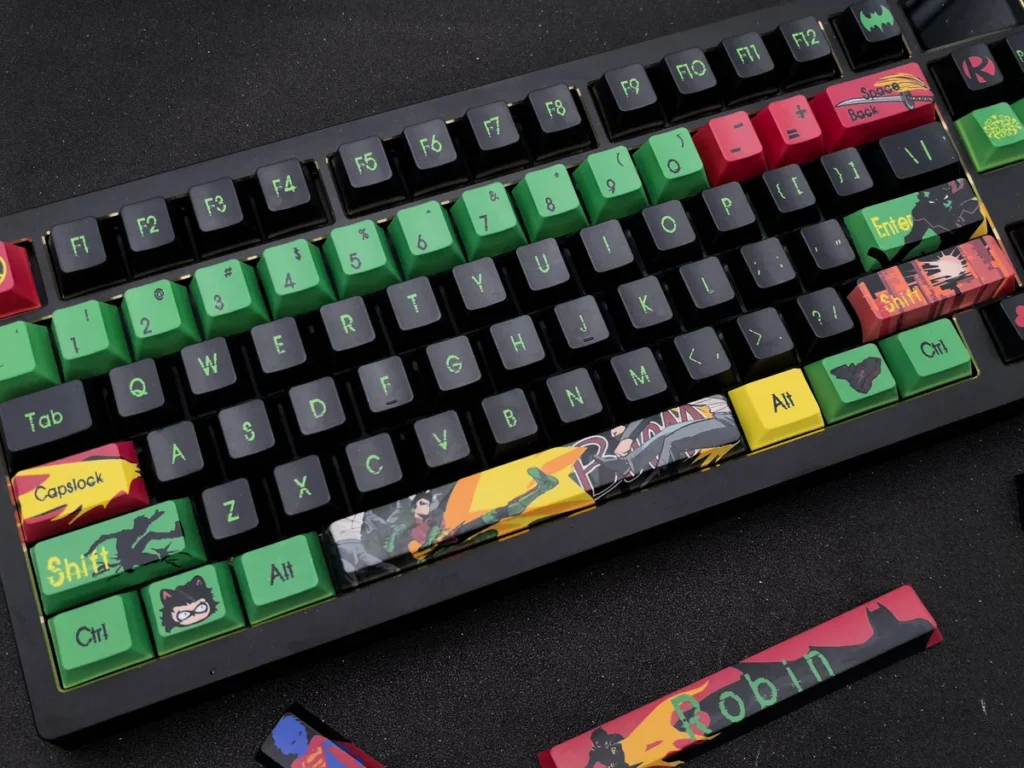 Exclusive Damian Wayne Robin artisan keycap set, intricately detailed with vibrant comic book aesthetics, showcasing the Vigilant Spirit in a dynamic pose.