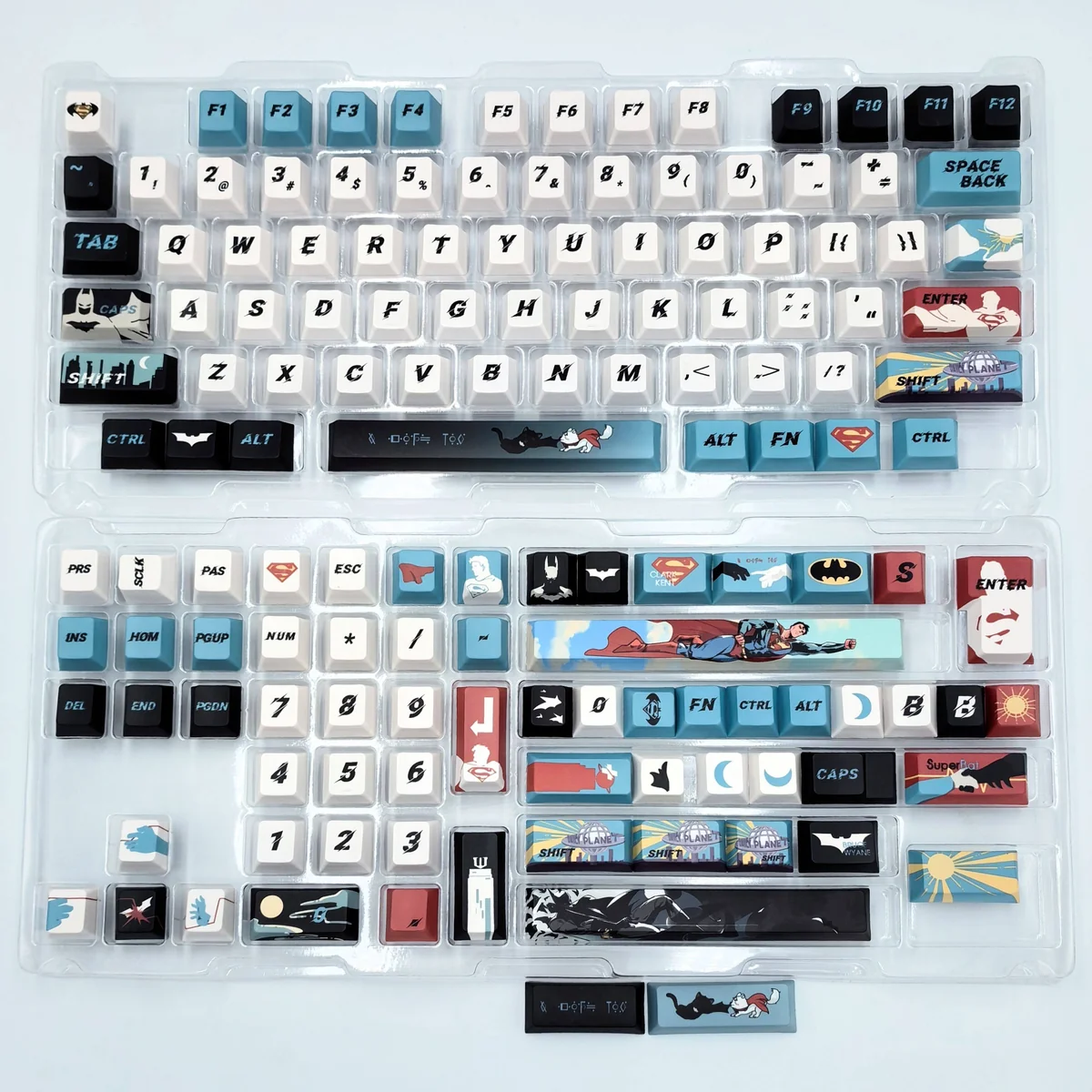 Close-up views of an exclusive handcrafted DC Comics Superman-Batman artisan keycap set, showcasing intricate details and artistic design from multiple angles.