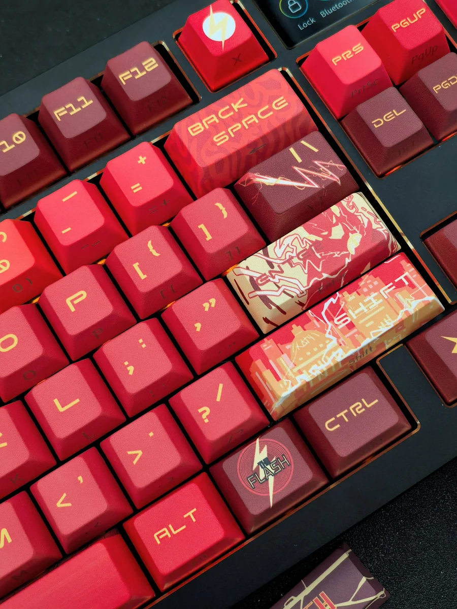 Premium DC Flash artisan keycap set for mechanical keyboards, showcasing its iconic insignia, lightning motifs, and sleek side-engraved design in vibrant aesthetics.
