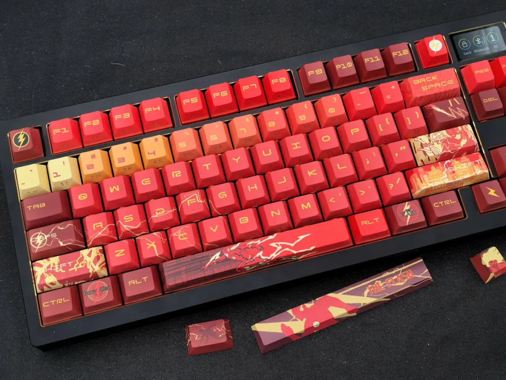 Exclusive DC Flash artisan keycap set for mechanical keyboards, showcasing the vibrant red lightning insignia and sleek side-engraved design.