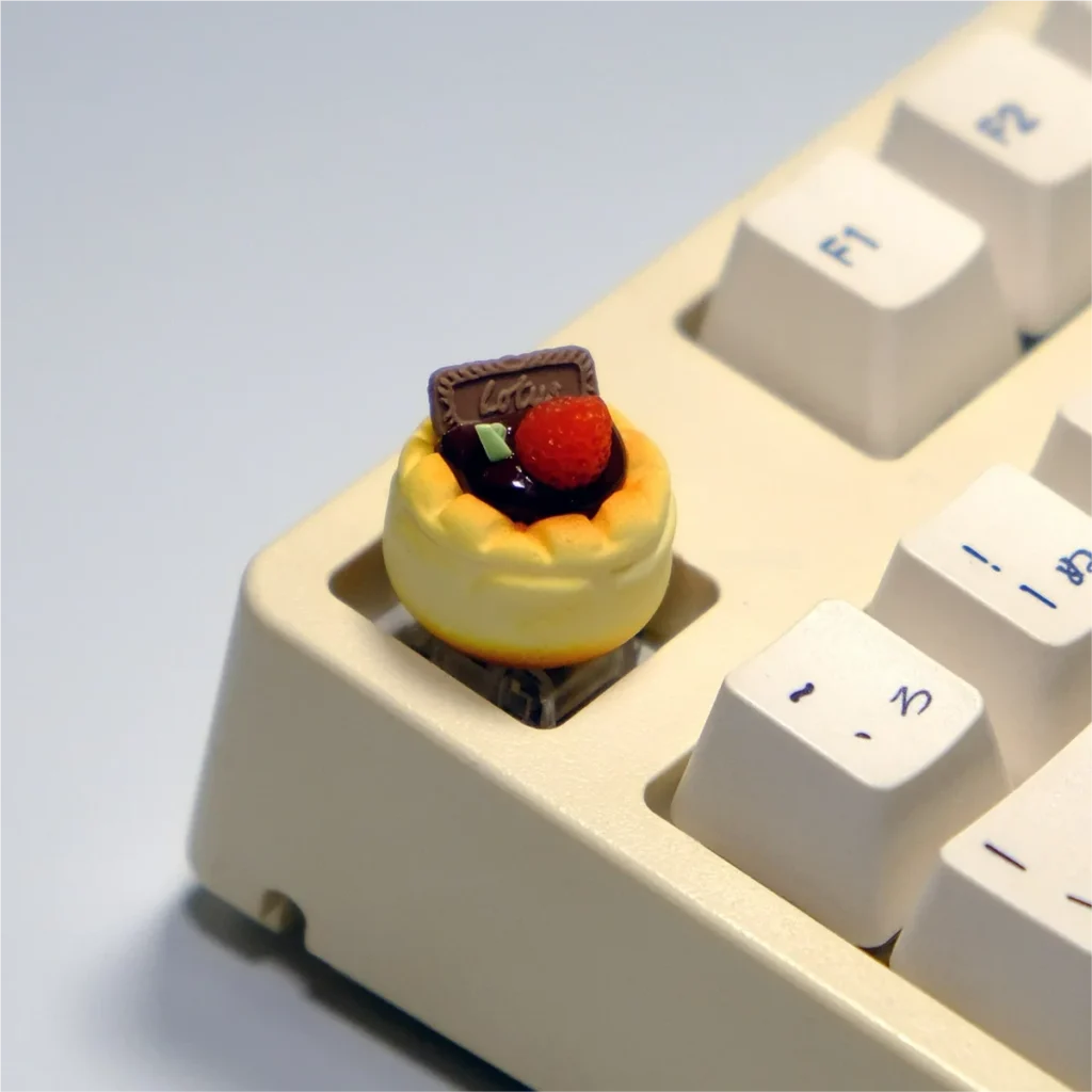 Another angle of a whimsical handcrafted dessert artisan keycap, revealing intricate 3D details of dessert among sweet, vibrant miniature.