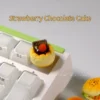 Close-up views of a whimsical handcrafted dessert artisan keycap, featuring intricate 3D details and vibrant sweet miniature treats from various angles.