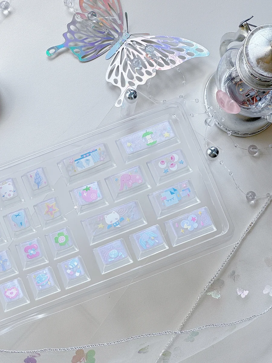 Multiple views of iridescent Dreamscape glitter keycaps set, showcasing their transparent PC design, ethereal sparkle, and whimsical aesthetic.