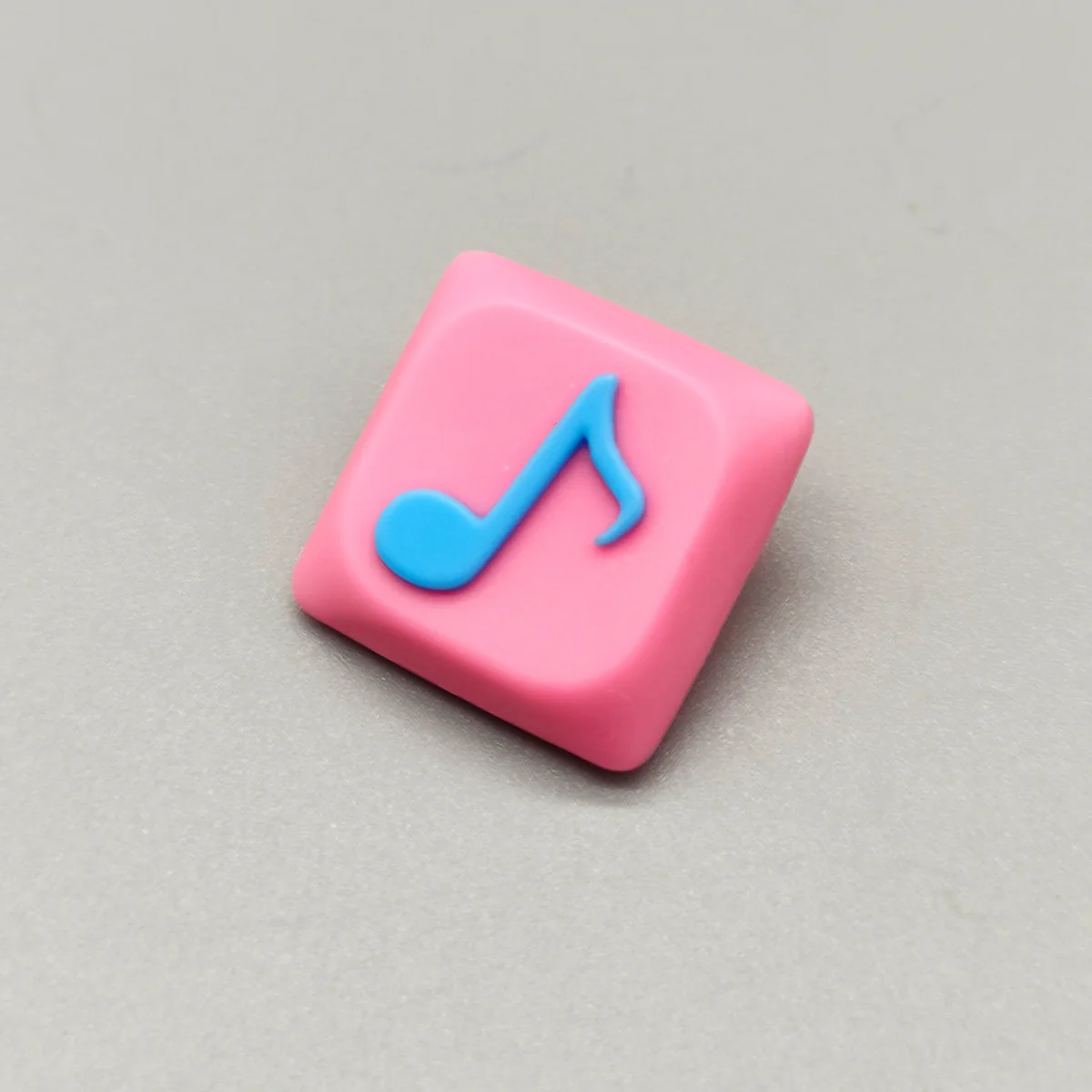 Handcrafted Eighth Note Symbol Keycaps featuring a vibrant pink translucent resin base with an embedded eighth note, embodying a musical symphony.