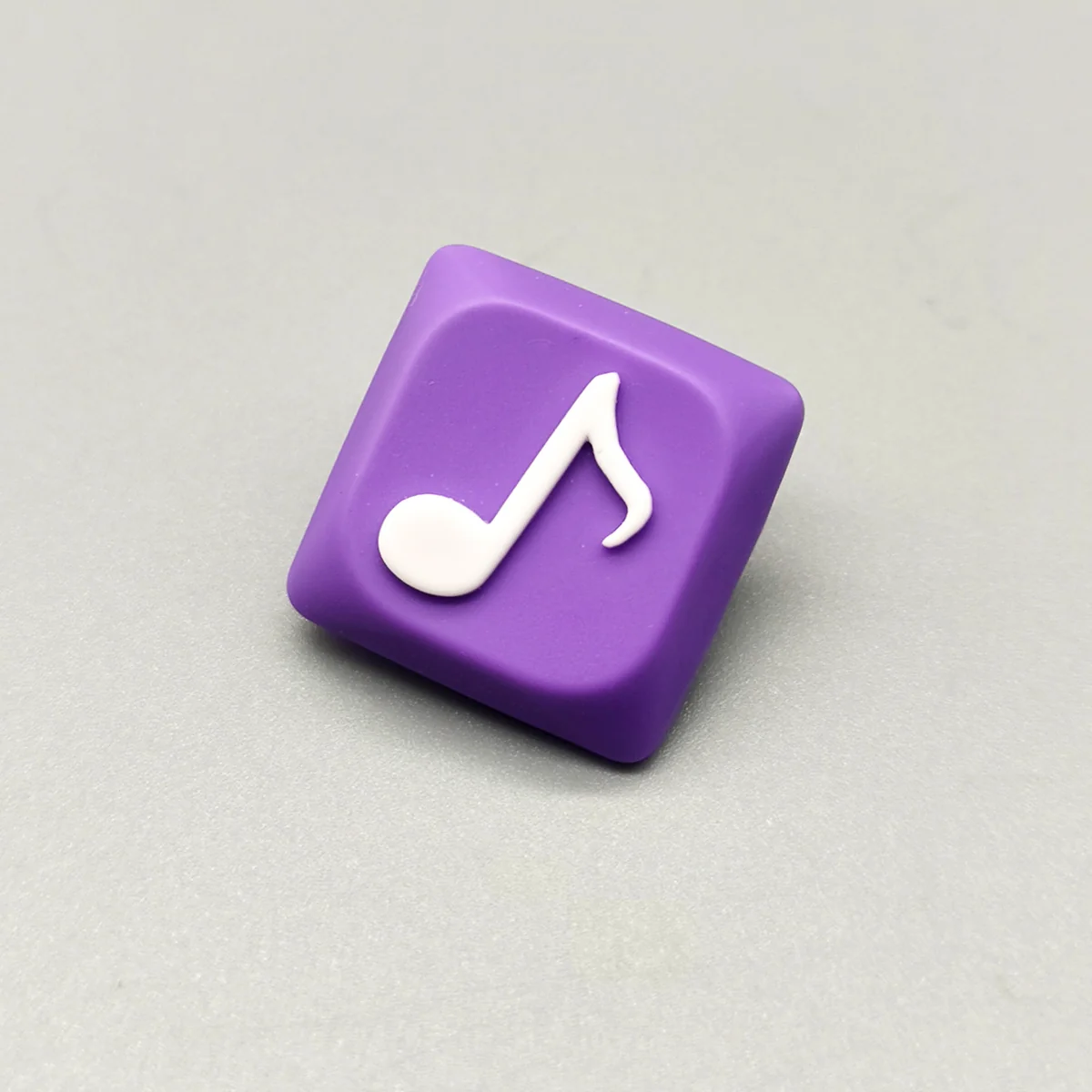 Handcrafted Eighth Note Symbol Keycaps with a vibrant translucent purple resin base, elegantly featuring an embedded eighth note, celebrating artistic crafted.