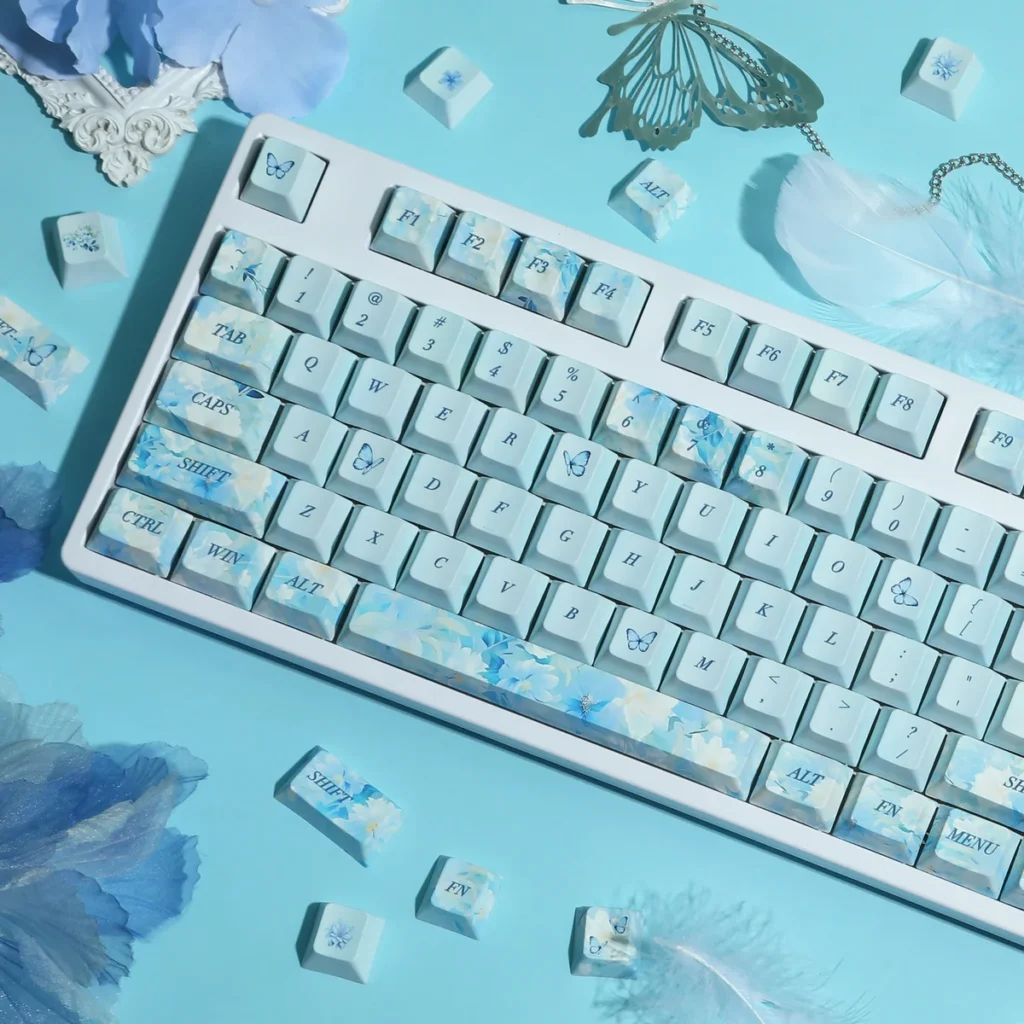 Endless Summer Keycaps Set close-up: durable PBT dye-sublimated set. Pastel blues, greens, whites evoke a serene, artistic, sun-drenched summer aesthetic.