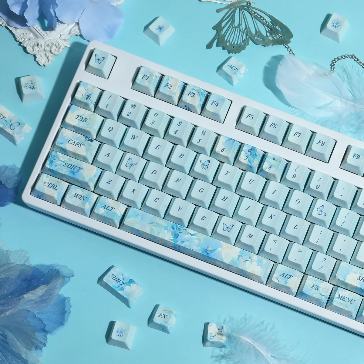 Endless Summer Keycaps Set close-up: durable PBT dye-sublimated set. Pastel blues, greens, whites evoke a serene, artistic, sun-drenched summer aesthetic.