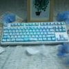 Endless Summer PBT dye-sublimated keycaps set in soft pastel blues, greens, and whites, offering a durable and serene artistic keyboard aesthetic.