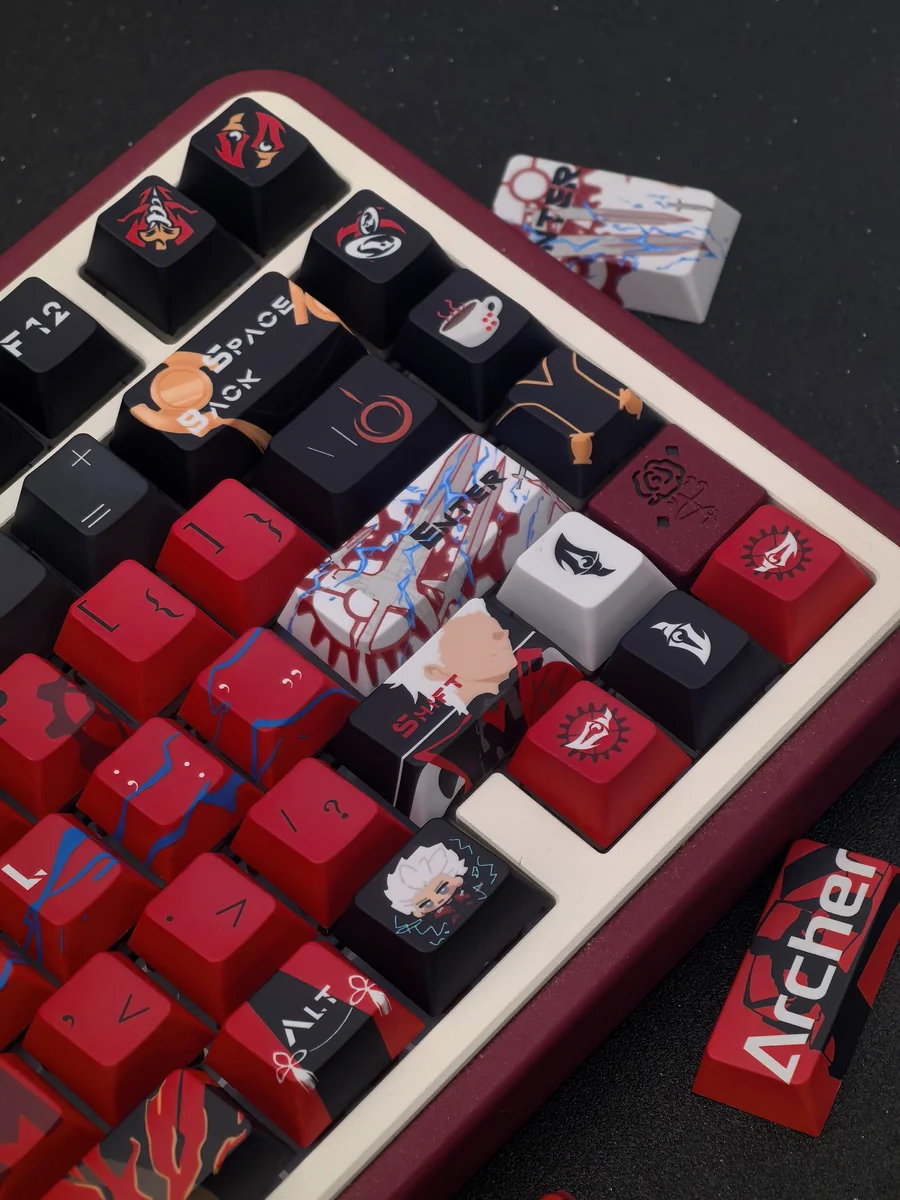 A close-up top view of the premium Fate/Stay Night Red Archer keycap set, showcasing its exclusive heroic design with intricate red and black anime character design.