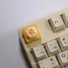 Close-up gallery of the whimsical handcrafted 3D fried egg toast artisan keycap, showcasing its vibrant yellow yolk and crisp white toast from multiple angles.