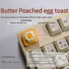 Playful artisan keycap featuring a handcrafted 3D creamy fried egg on golden toast, a whimsical miniature design.