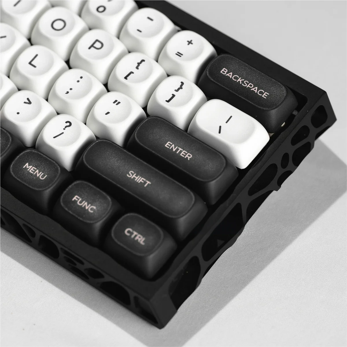 Angled shot of the PBT Galaxy Keycaps set, emphasizing the ergonomic MOA profile and intricate monochrome celestial patterns for an immersive cosmic aesthetics.