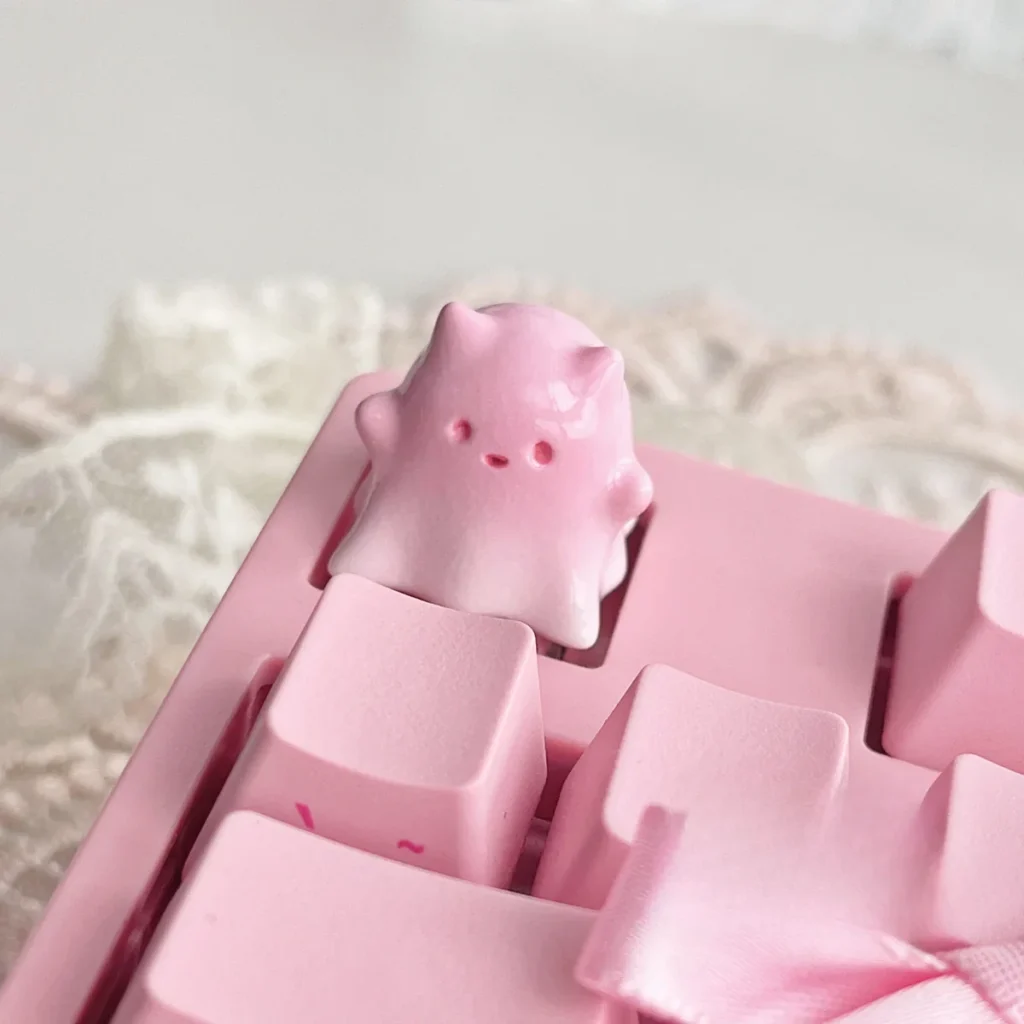 Whimsical hand-painted ghost cat keycap art, translucent pastel resin details from various angles, showcasing its unique and ethereal design.