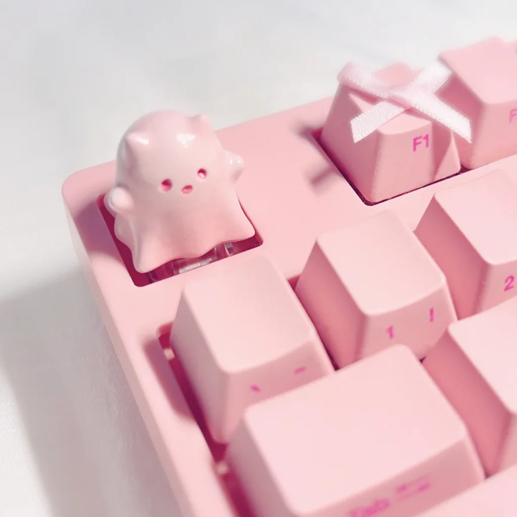 Whimsical hand-painted resin ghost cat keycap. Unique design, translucent pastel gradients, and ethereal aesthetic shown from multiple angles.
