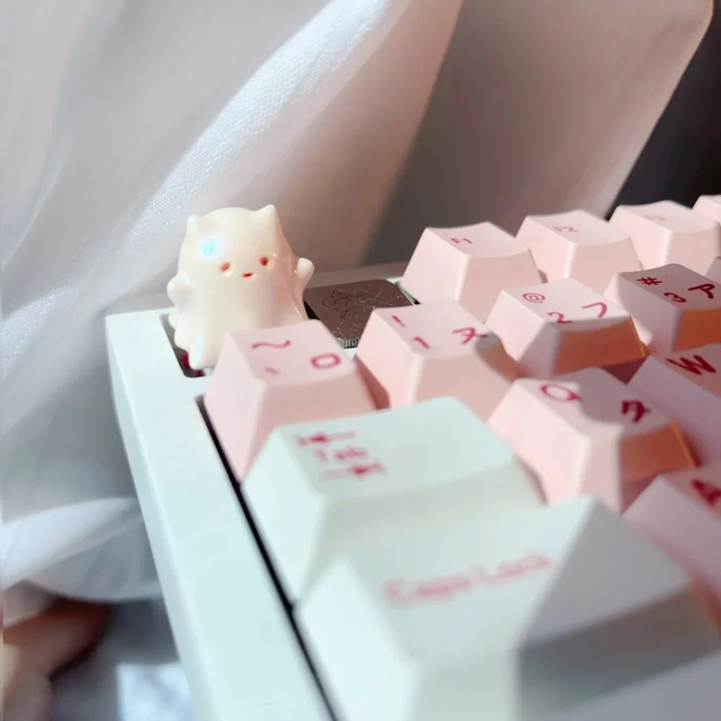 Whimsical Ghost Cat Keycap. Hand-painted resin art with a unique, cute, ethereal ghost cat design, featuring pastel gradients and translucent charm.