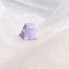 Hand-painted resin Whimsical Ghost Cat Keycap featuring a unique taro-purple head and translucent body, an ethereal piece of art.