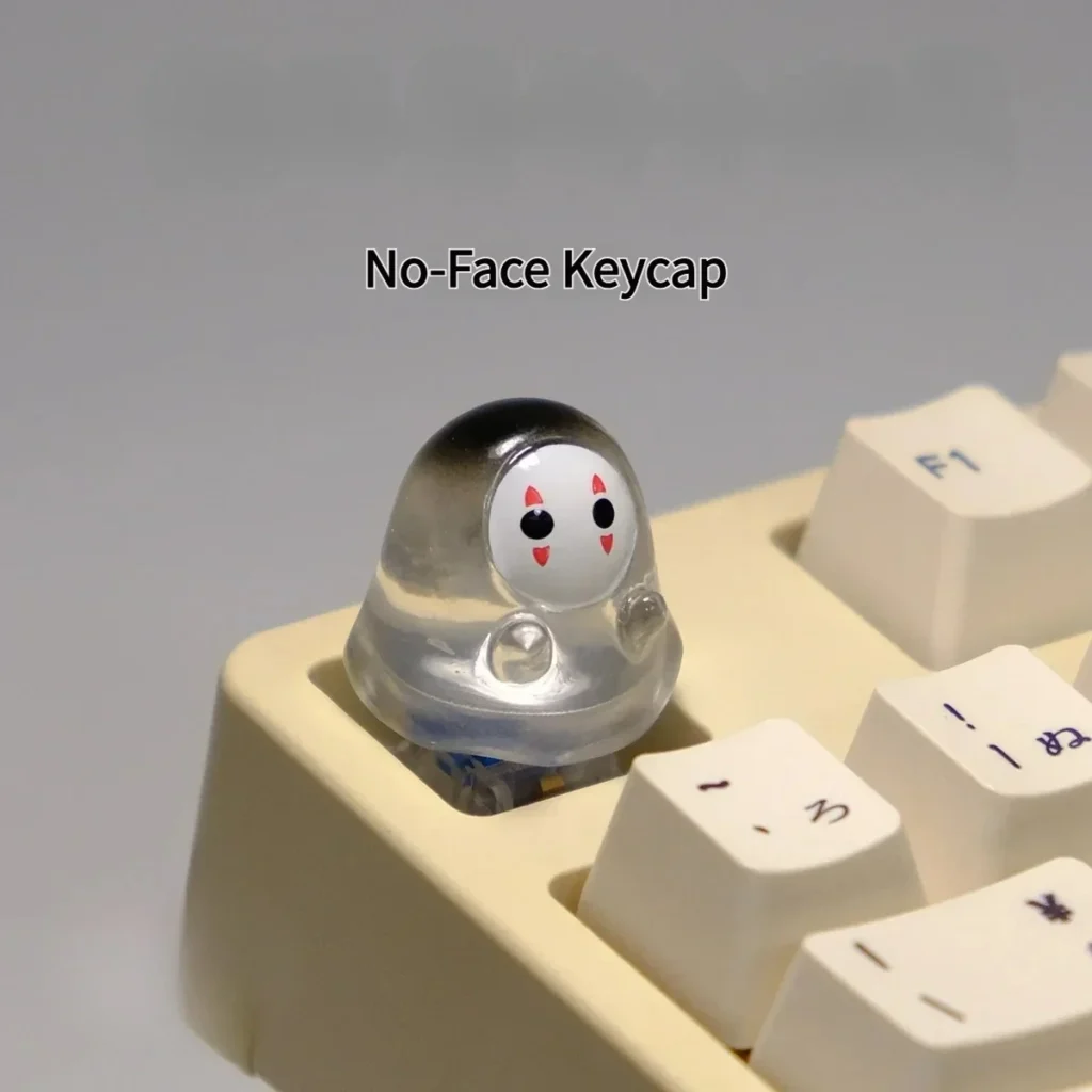 Cute handmade glowing No-Face keycap, a whimsical translucent 3D artisan figure casting an ethereal glow on a mechanical keyboard.