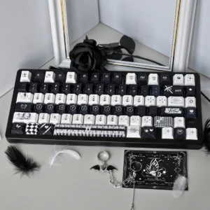 Gothic Lace PBT Keycap Set displaying intricate black lace patterns on white keys, showcasing its unique gothic design for a dreamlike, artistic keyboard.