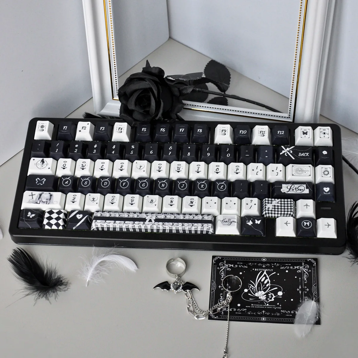 Gothic Lace PBT Keycap Set displaying intricate black lace patterns on white keys, showcasing its unique gothic design for a dreamlike, artistic keyboard.